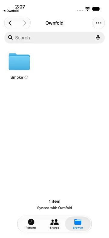 Apple’s Files app in the iOS Simulator, open on the Ownfold location, showing one test folder named Smoke and the footer ‘1 item, Synced with Ownfold’.